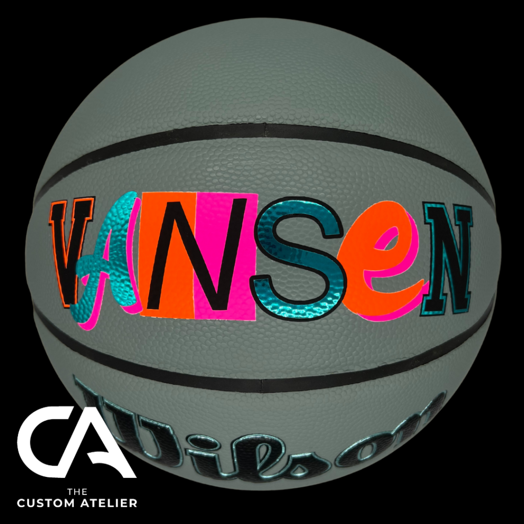 Customised Basketball in pink orange and blue.